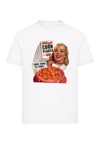 White cotton t-shirt featuring a retro Kellogg's Corn Flakes graphic with a bowl of cereal and a smiling woman holding a spoon.