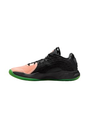 Black and pink athletic shoe with textured upper, green outsole, and contrasting materials. Features lace-up design and side accents.