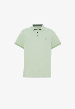 Polo shirt verde chiaro realizzato in tessuto testurizzato, con colletto, tre bottoni e un piccolo logo sul lato sinistro del petto. Maniche con accenti.