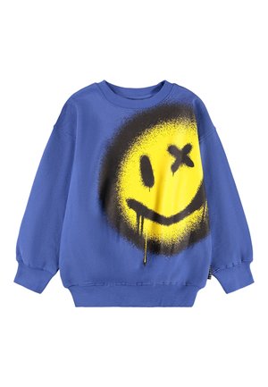 Blå oversized sweatshirt laget av bomull, med et stort gult smilefjes grafikk med svarte aksenter og malingsdrypp detaljer.
