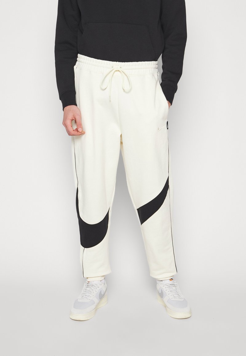 nike track pants big swoosh