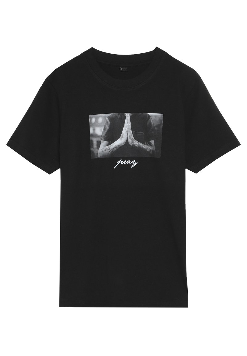 Black cotton t-shirt with short sleeves, featuring a graphic print of clasped hands and the word "pray" in white underneath.
