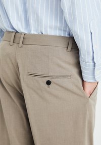 Weekday FLARED SUIT TROUSERS - Pantalon classique - dark mole