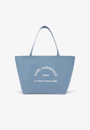 Sac cabas bleu clair avec doubles poignées et texte blanc "KARL LAGERFELD PARIS 21 RUE ST-GUILLAUME" au centre avant.