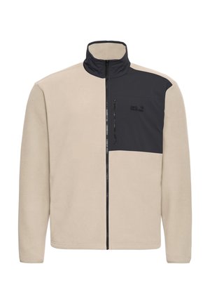 Fleecejas in beige met een donkergrijs paneel op de linkerbovenkant, hoge kraag en ritssluiting aan de voorkant. Voorzien van een borstzak met ritssluiting.