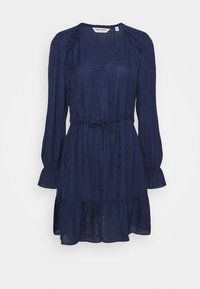 Vestido azul marino con mangas largas abullonadas, cintura ajustada y un dobladillo con volantes en capas. Hecho de una tela ligera y texturizada.