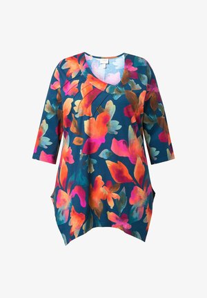 Tunika floreale con maniche a tre quarti, caratterizzata da fiori vivaci arancioni, rosa e turchesi su sfondo blu scuro. Materiale morbido, tasche laterali.