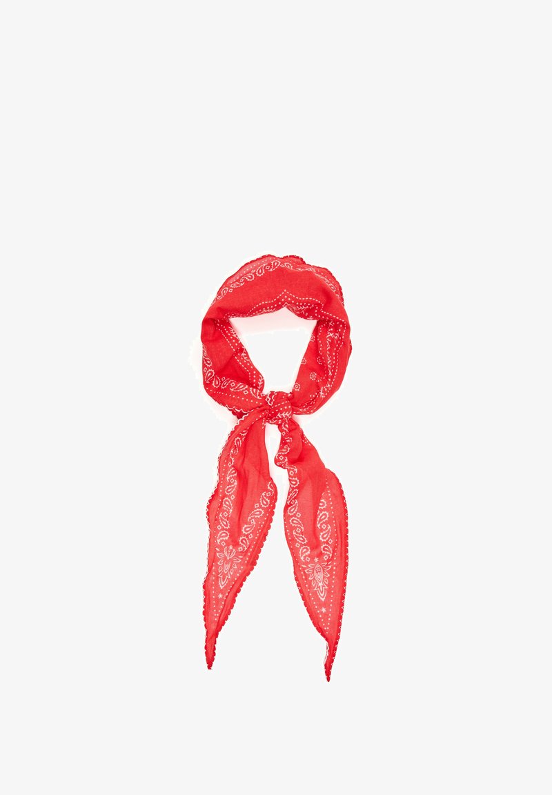 Red bandana with white paisley patterns tied in a loose knot against a white background.