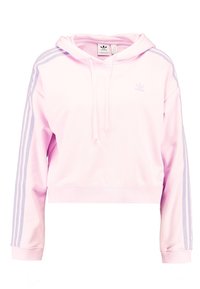 Rosa kort hoodie i mjukt material, med en dragsko i huvan och tre vita ränder längs varje ärm. Adidas-logga på bröstet.