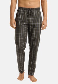 Heren pyjamabroeken in donkergroen katoen, met een groot ruitpatroon in wit en blauw. Elastische tailleband met strikkoord.
