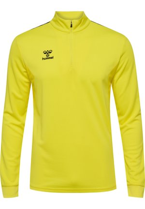 Gele langärmige prestatieshirt met een hoge kraag, halve rits, gestructureerde stof en zwart logo op de borst.