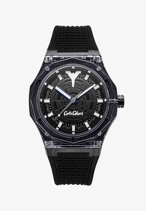 Black wristwatch with clear octagonal bezel, textured dial, bold white hour markers, silver and blue hands, black textured strap, and Carlo Colucci logo.