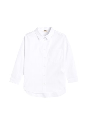 Weißes langärmeliges Hemd mit Knöpfen aus weichem Baumwollstoff. Verfügt über einen klassischen Kragen, eine einzelne Brusttasche und einen abgerundeten Saum.