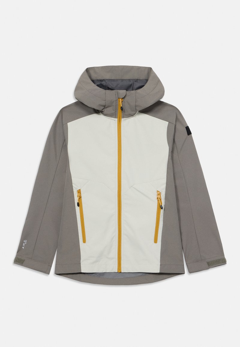 Veste à capuche grise et blanc cassé, dotée d'une fermeture éclair jaune, de deux poches zippées et de panneaux texturés. Disponible en différentes tailles.