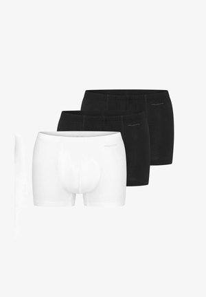 Tre par herre boxershorts, to sorte og et hvidt, placeret side om side, lavet af afslappet bomuldsstof.