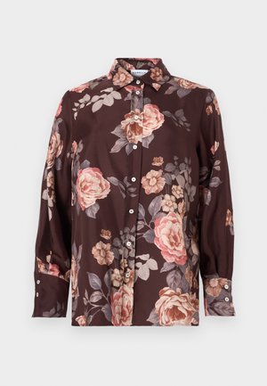 Dark brown button-up shirt featuring large pink and beige floral patterns. Made of smooth fabric with long sleeves and buttoned cuffs.