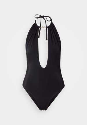 Must ühes tükis ujumisriietus, millel on sügav V-kaelus, kaela taha seotud paelad, rinnal kokku kogutud kangas ja kaelusel kuldne logo detail.