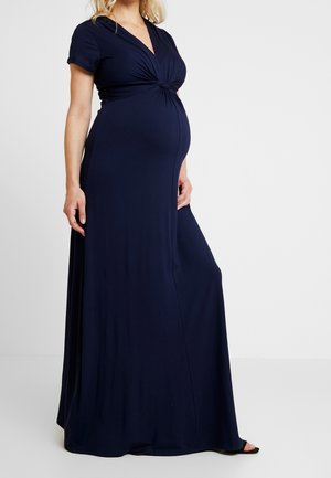 Robe maxi de maternité bleu marine avec manches courtes, décolleté en V profond et détail de nœud froncé à l'avant. Fabriquée en tissu doux et extensible.