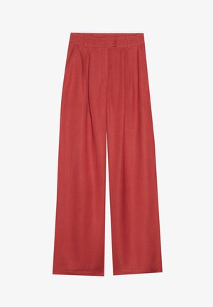 Wide-legged trousers in a rich terracotta color, made of textured fabric with front pleats and a classic waistband.