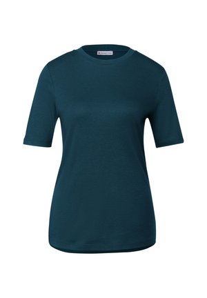 Camiseta de manga corta en color azul verdoso, hecha de una suave tela de algodón. Presenta un cuello redondo y un corte holgado. Textura suave sin patrones ni herrajes visibles.