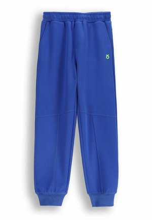 Niebieskie spodnie dresowe z elastycznym pasem i ściągaczami, przednimi kieszeniami oraz małym zielonym logo na lewym udzie.
