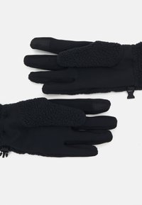Sorte hansker med et mykt, teksturert fleecepanel på baksiden, elastiske mansjetter, og et strømlinjeformet, glatt design. Har en krok for festing.