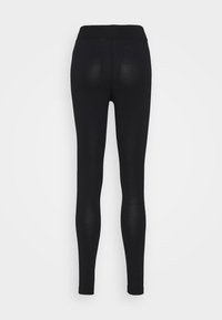 Svarta leggings gjorda av stretchigt material, med hög midja och en slät yta utan synliga sömmar. Bakvy visas.