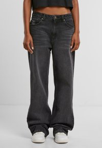 Zwarte denim wijde jeans met hoge taille, vijf zakken en subtiele vervaging. Voorzien van een logo-opdruk op de voorkant en een gestructureerde stof.