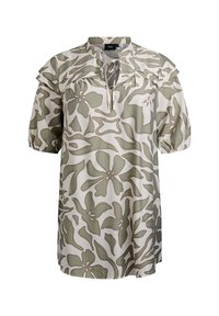 Blusa a maniche corte color crema con motivi floreali verdi. Presenta un collo a oblò, dettagli arricciati sulle spalle e una vestibilità comoda.