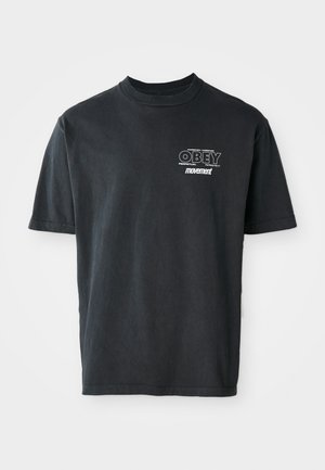 Black cotton t-shirt with short sleeves, a crew neckline, and white graphic text reading "OBEY" and "movement" on the chest.