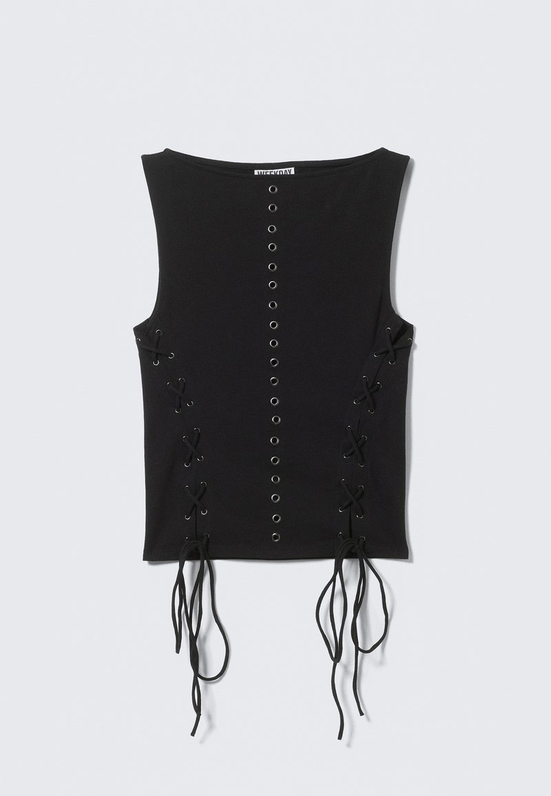 Haut noir sans manches avec détails à œillets à l'avant et côtés lacés. Confectionné dans un tissu doux avec des liens suspendus au bas.