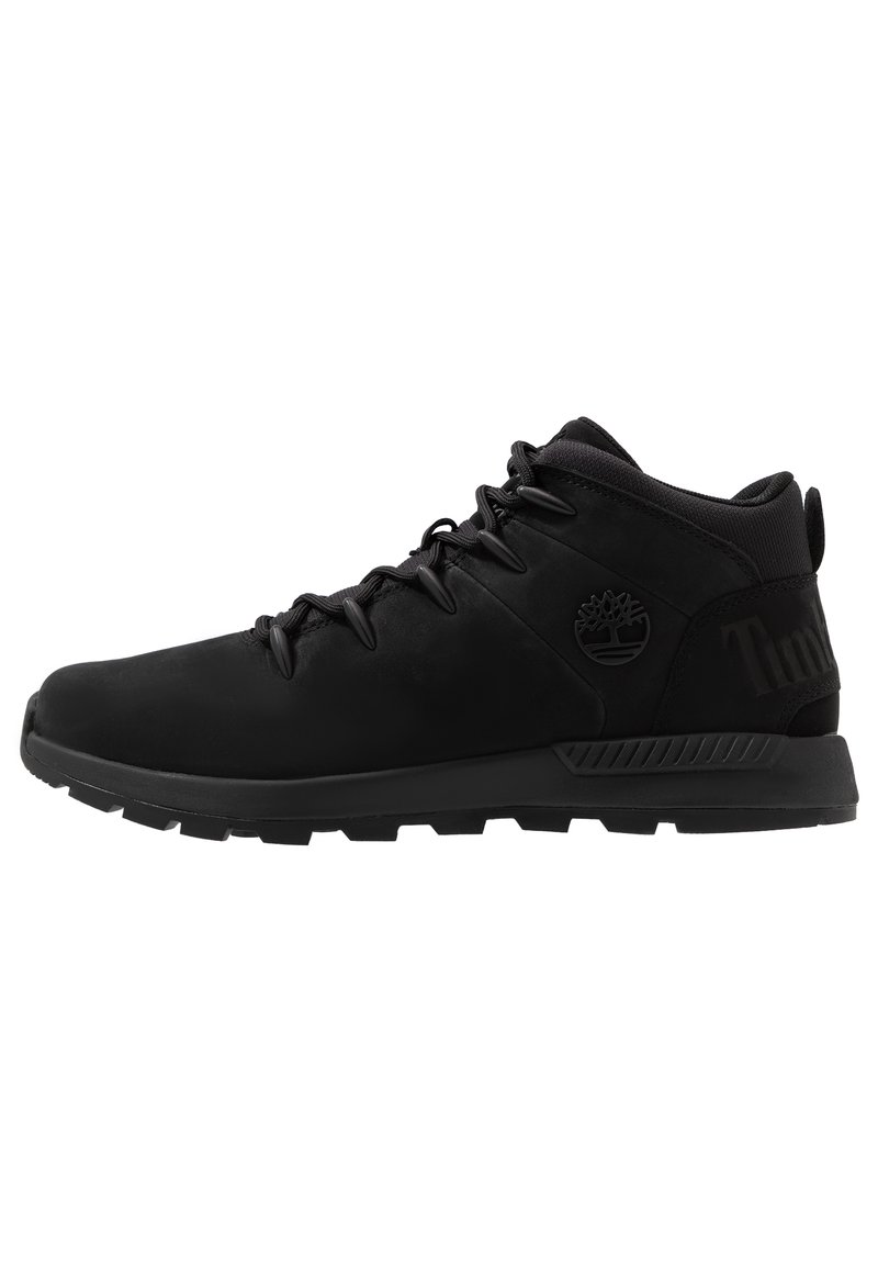 Schwarze halbhohe Schuhe aus glattem Synthetikmaterial. Verfügen über eine strukturierte Gummisohle, Schnürverschluss und ein Logodetail an der Seite.
