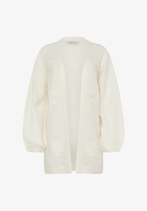 Roomkleurige gebreide cardigan met open voorkant, ballonmouwen en subtiele bloemenpatronen op de voorkant en mouwen.