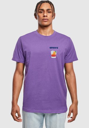 Purple cotton t-shirt with short sleeves, featuring "SPRITZ" text and a colorful glass with an orange slice graphic on the chest.