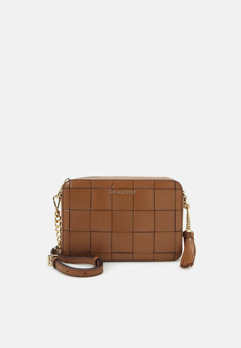 Brown leather crossbody bag with grid pattern, gold hardware, chain and leather strap, and tassel detail. Marked with "MICHAEL KORS" logo.
