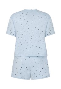 Lichtblauw katoenen slaapset met korte mouwen en korte broek, met een zwart polkadot patroon op zowel het bovenstuk als de broek.