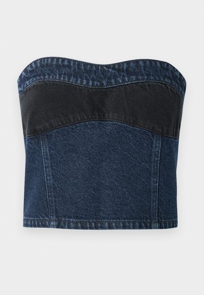 Denim strapless top featuring a dark blue design with a black panel across the upper section, smooth texture, and curved neckline.