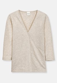Beżowa bluzka z długim rękawem w stylu kopertowym z głębokim dekoltem w kształcie litery V i teksturowanym materiałem. Posiada boczną kieszeń i gładkie wykończenie.