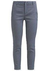 Pantalon slim bleu marine avec un motif géométrique blanc en forme de losange, poches avant et taille mi-haute.