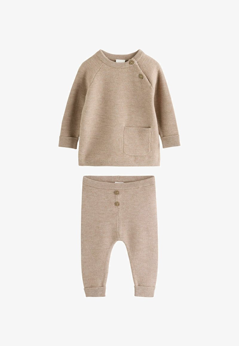 Beige knitted baby outfit with long-sleeve top featuring two shoulder buttons and front pocket, paired with matching pants with two front buttons.