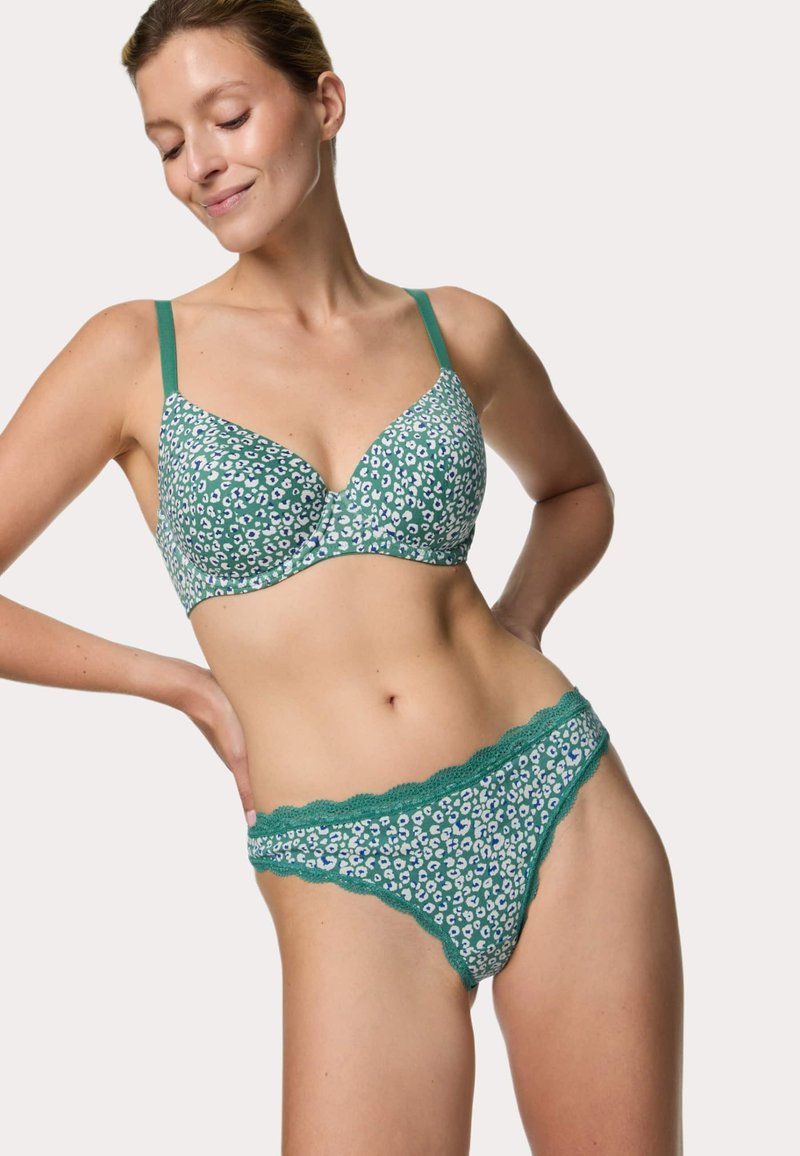 Zelená podprsenka a tanga set s květinovým leopardím potiskem. Obsahuje nastavitelné ramínka, krajkový lem a hladkou texturu látky.