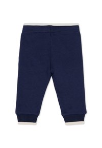 Marineblauwe joggingbroek van zachte stof. Elastische tailleband met contrasterende kleuraccenten. Ribgebreide boorden bij de enkelopeningen. Geen zichtbare zakken.
