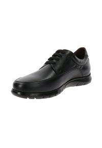 Scarpa nera in pelle con lacci, dalla texture liscia, punta arrotondata e suola in gomma flessibile. Presenta cuciture minime e un design elegante.