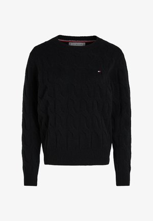 Mustakotimainen neulepaita, jossa on pyöreä pääntie ja ribbaus helmassa ja hihoissa. Rintakehässä pieni logodetail. Pehmeä rakenne.