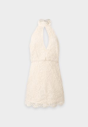 Hihaton kerma pitsinen halter-mekko, jossa avonainen pääntie ja aaltoileva helma, jossa on kukka- ja kiemurakuvioita.