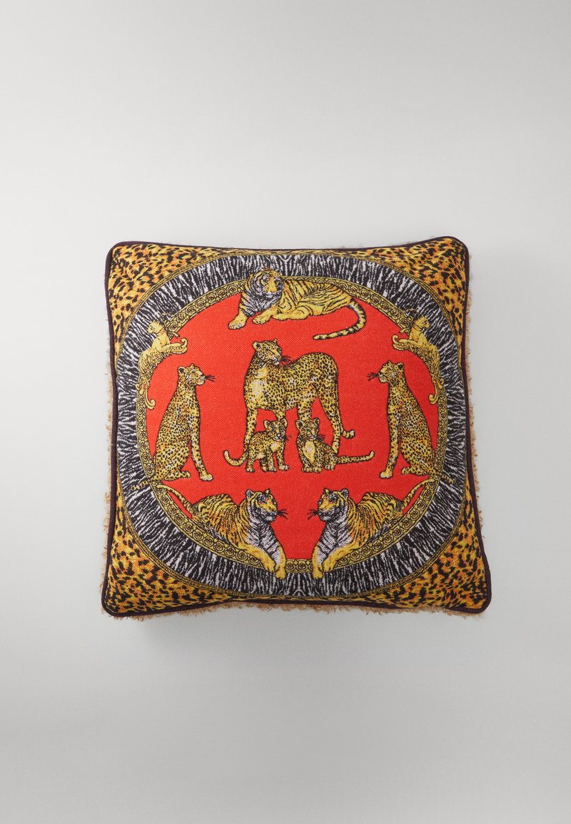 Red square cushion featuring a central leopard and tiger design with black and gold accents, bordered by a leopard print pattern.