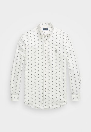 Biała koszula na długi rękaw z guzikami, z drobnymi czarnymi logo konika Polo Ralph Lauren nadrukowanymi na całej powierzchni oraz większym haftowanym logo na piersi.