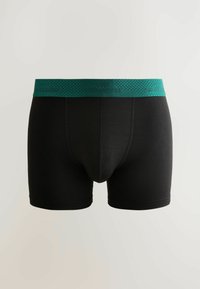Boxeri negri cu un elastic texturat verde la talie. Au o croială strânsă și un material neted. Fără modele sau desene vizibile.