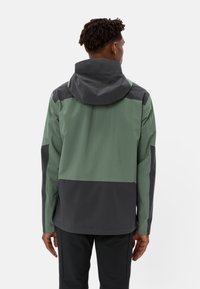 Waterproof jacket in dark green and grey. Features a hood, smooth texture, and color-block design with contrasting panels.