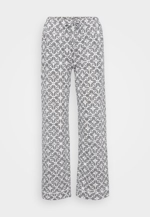 Bredde benbukser laget av lett materiale, med et svart-hvitt blomstret geometrisk mønster, elastisk midjebånd og snøring.